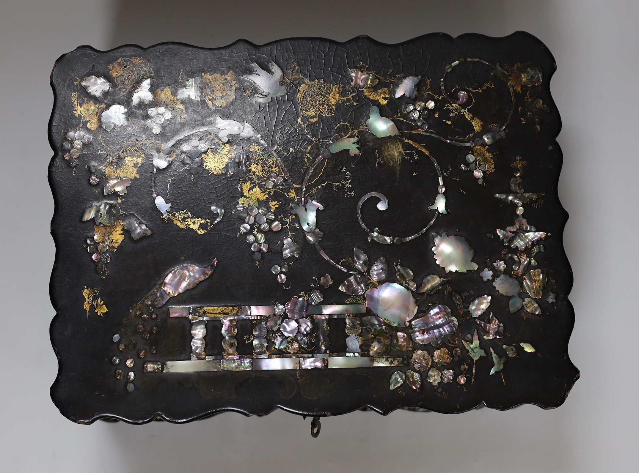 A Victorian papier mache workbox and contents, 32cm